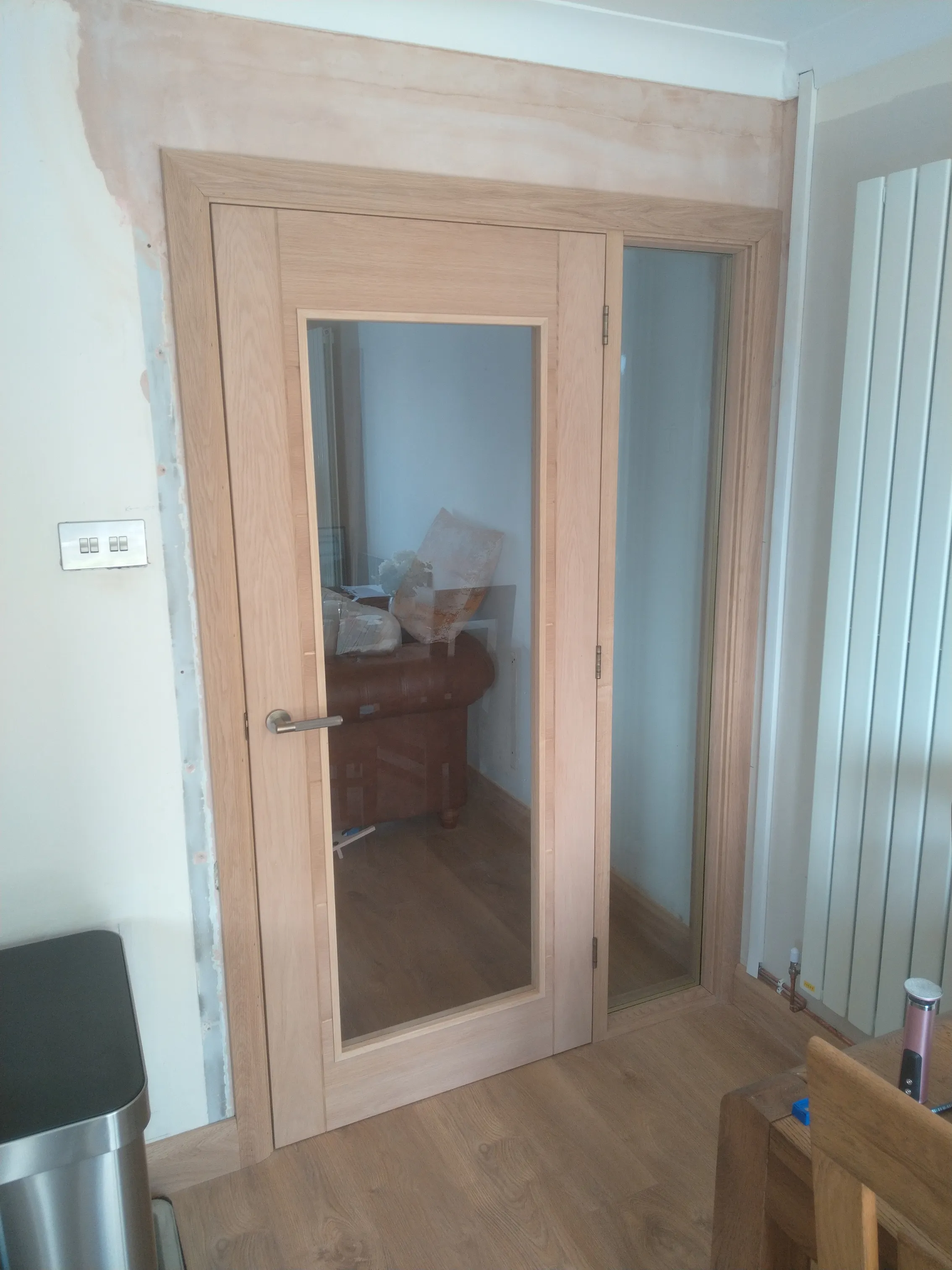 Oak glazed door and frame fitting